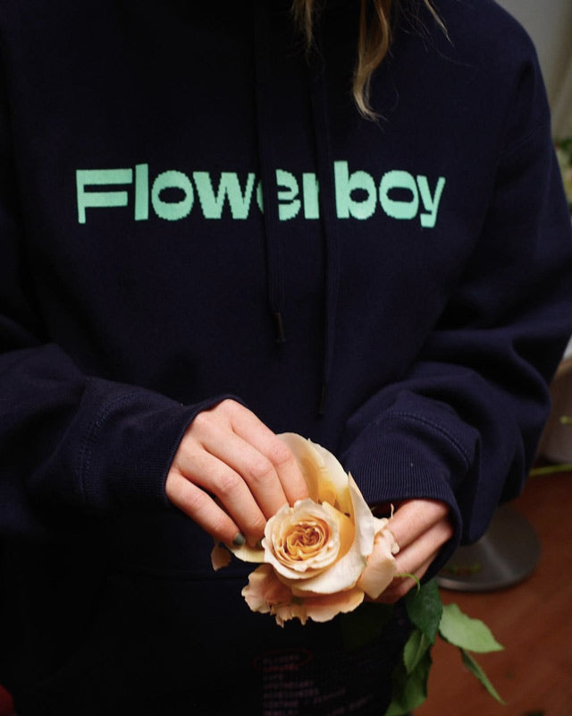 Detail of Flowerboy Project crewneck with woman holding rose